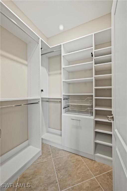 walk in closet featuring light tile patterned floors