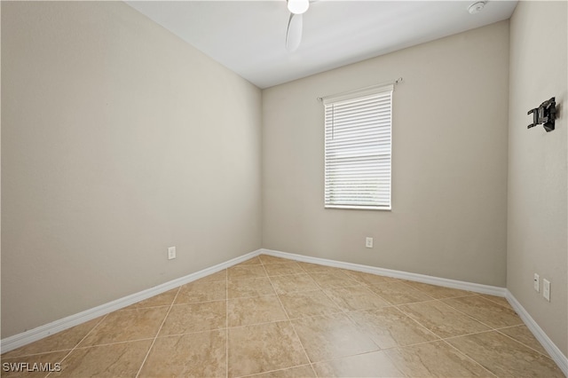 unfurnished room featuring ceiling fan and light tile patterned floors