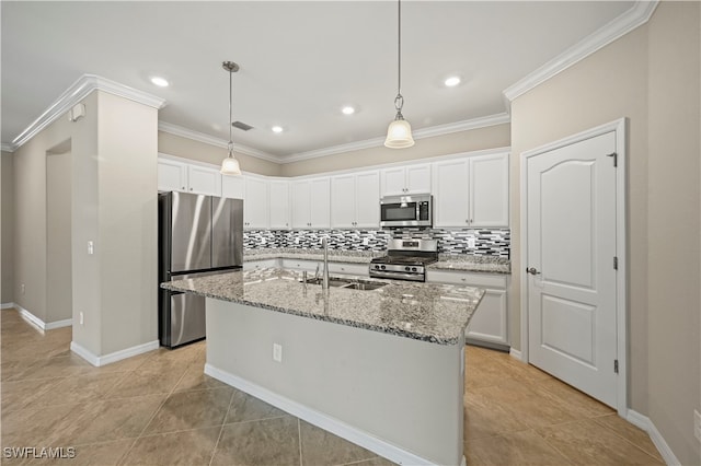 kitchen featuring light stone countertops, an island with sink, stainless steel appliances, sink, and white cabinets