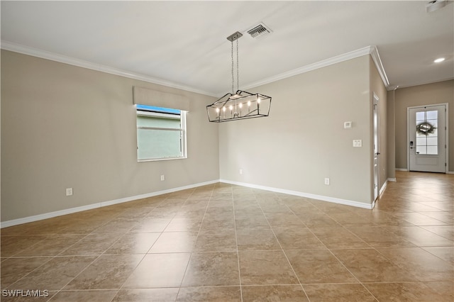 tiled spare room with ornamental molding and an inviting chandelier