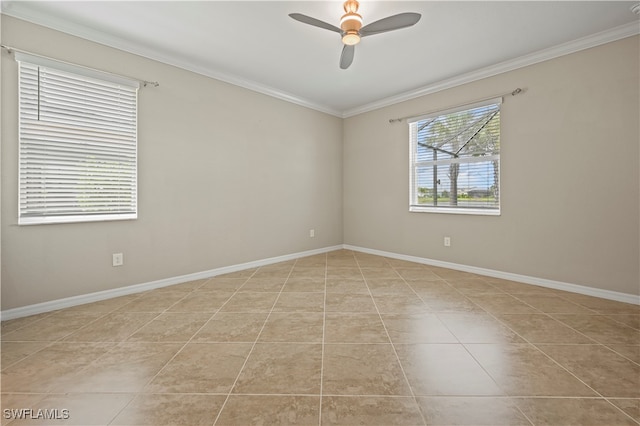 tiled empty room with ceiling fan and crown molding