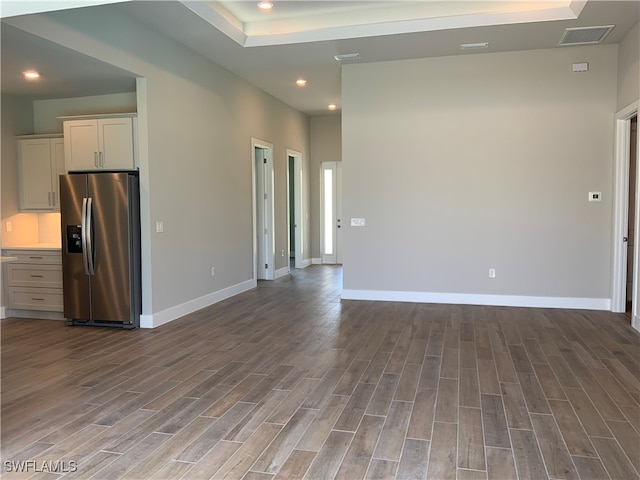 unfurnished room with hardwood / wood-style flooring