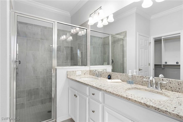 bathroom featuring vanity, crown molding, and walk in shower