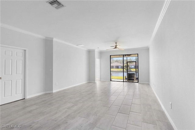 spare room with ornamental molding and ceiling fan