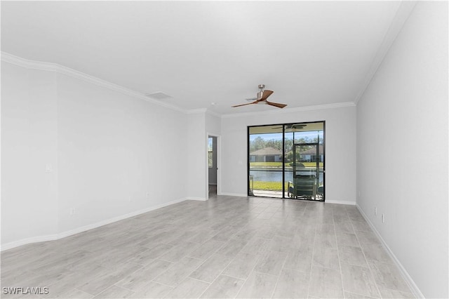 spare room featuring crown molding, ceiling fan, and a water view