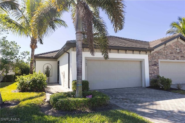 view of front of property with a garage