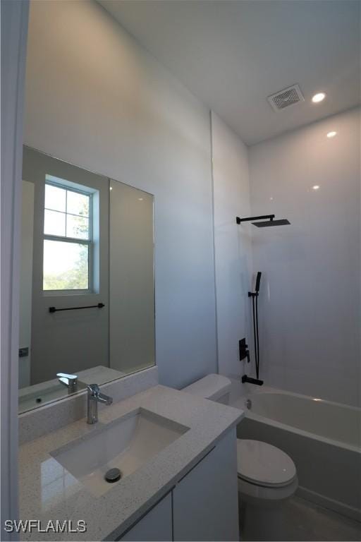 bathroom with vanity,  shower combination, toilet, and visible vents