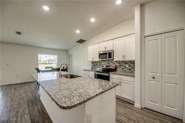 kitchen with stainless steel appliances, sink, wood-type flooring, and white cabinets