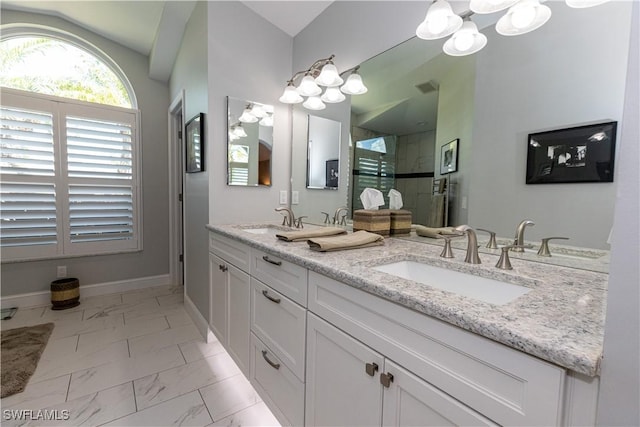 full bath with marble finish floor, visible vents, a sink, and a stall shower