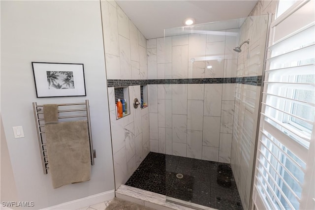 full bath featuring tiled shower