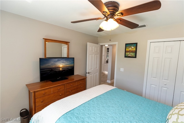 bedroom featuring ceiling fan and a closet