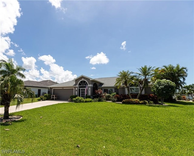 ranch-style house featuring an attached garage, concrete driveway, and a front yard