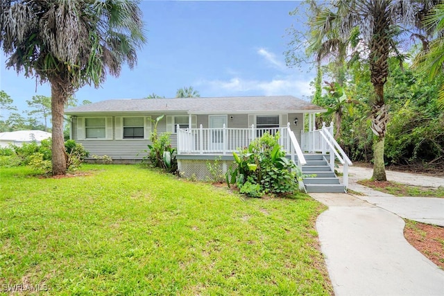 view of front of property featuring a porch and a front lawn