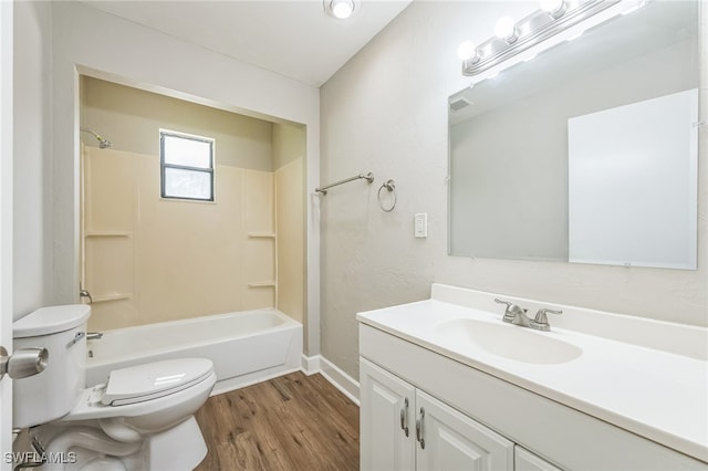 full bathroom featuring vanity, toilet, hardwood / wood-style floors, and shower / tub combination