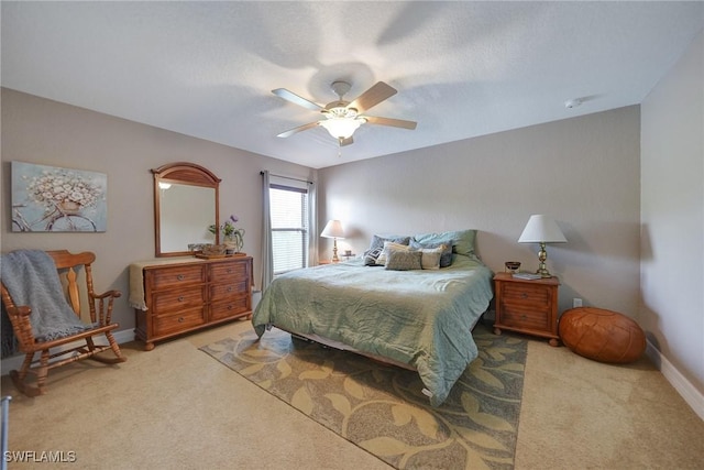 bedroom with light carpet and ceiling fan