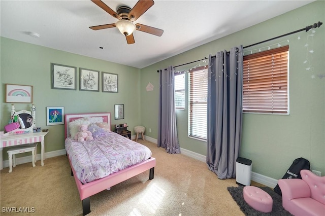 bedroom featuring light carpet and ceiling fan