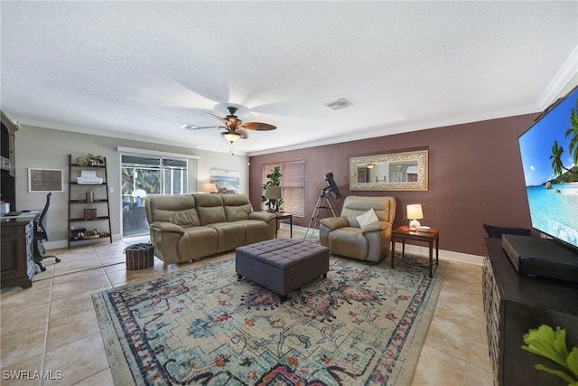 living room with crown molding, ceiling fan, light tile patterned flooring, and a textured ceiling