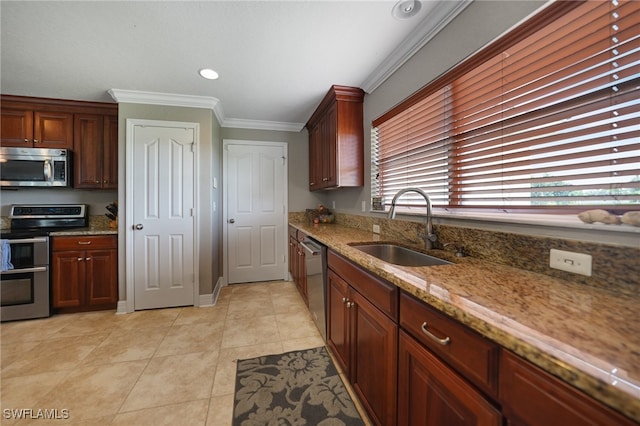 kitchen featuring sink, light stone counters, appliances with stainless steel finishes, light tile patterned floors, and ornamental molding