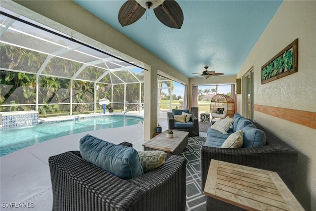 view of swimming pool featuring a lanai, ceiling fan, a patio area, and an outdoor hangout area