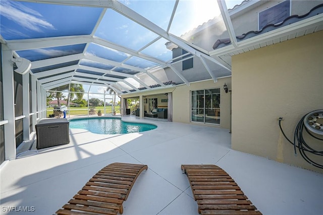 view of pool featuring a lanai and a patio