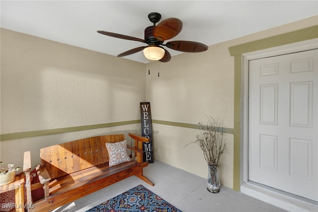 view of exterior entry featuring ceiling fan