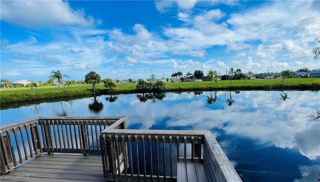 view of dock with a water view and a balcony