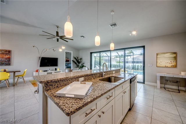 kitchen with pendant lighting, a center island with sink, visible vents, stainless steel dishwasher, and a sink