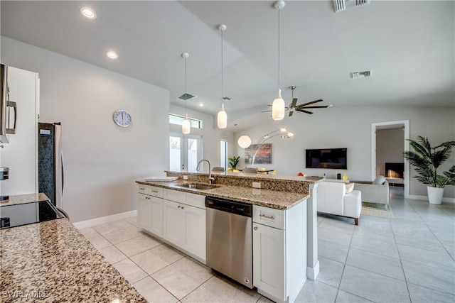 kitchen with visible vents, dishwasher, open floor plan, freestanding refrigerator, and a sink