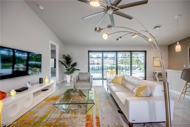 living area featuring light tile patterned floors, baseboards, and visible vents