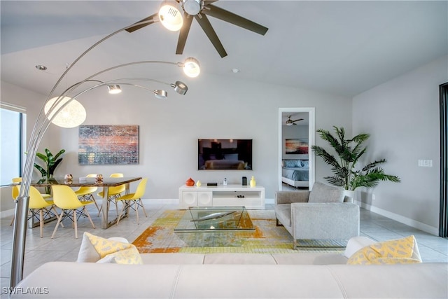 tiled living room featuring lofted ceiling and baseboards