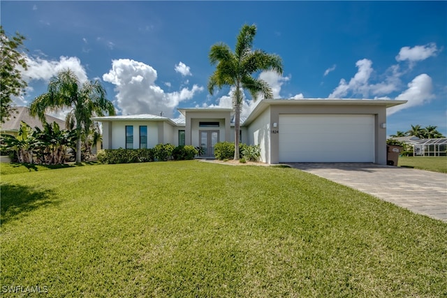 view of front of house featuring a garage and a front yard