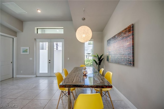 dining room with french doors, baseboards, and light tile patterned floors