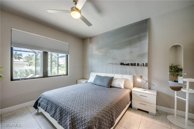 bedroom with baseboards, a ceiling fan, and tile patterned floors