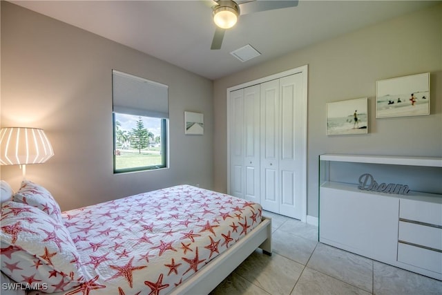 bedroom featuring tile patterned flooring, a closet, and ceiling fan