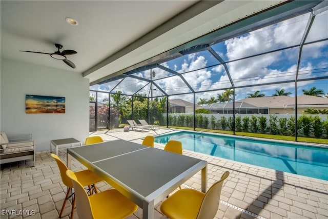 view of pool featuring a patio area, a lanai, a fenced in pool, and a ceiling fan