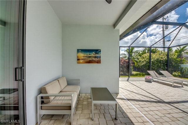 view of patio featuring glass enclosure and outdoor lounge area