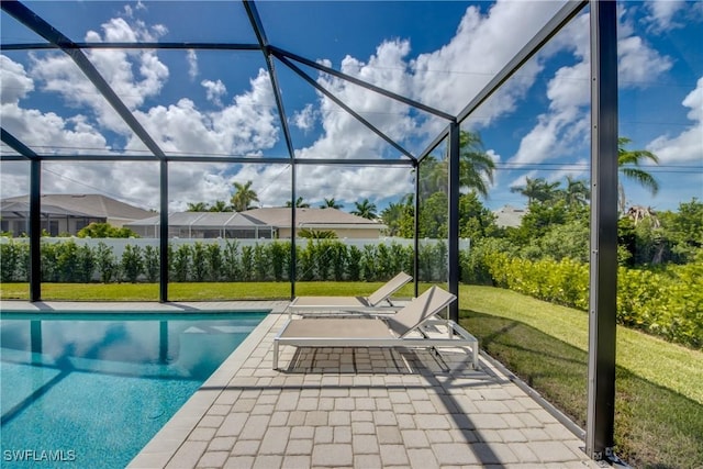 pool with a yard, a lanai, and a patio