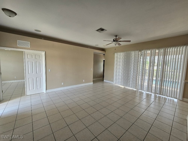 unfurnished room with ceiling fan