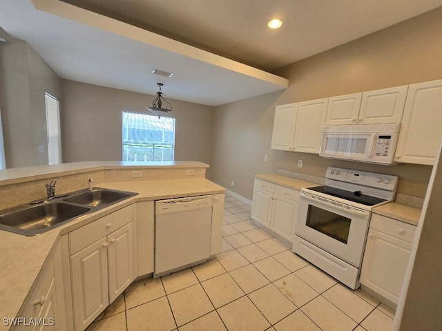 kitchen with white appliances, white cabinetry, sink, light tile patterned flooring, and pendant lighting