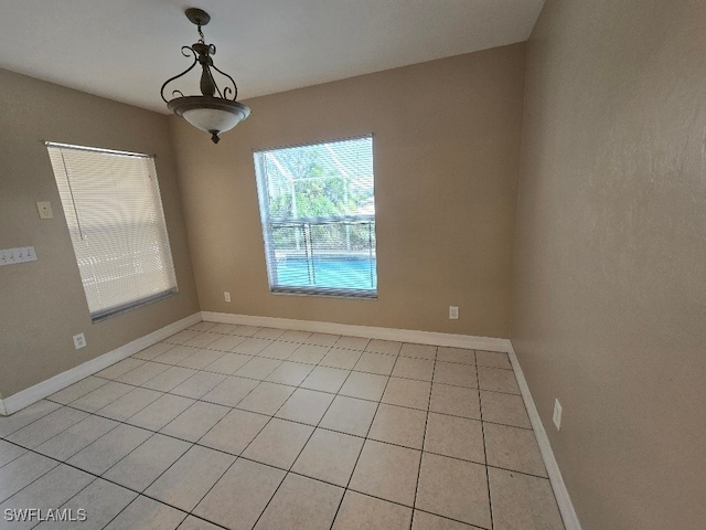 spare room with light tile patterned flooring