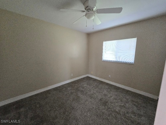 carpeted empty room featuring ceiling fan