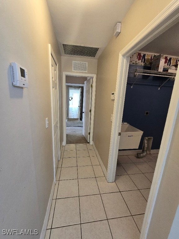 corridor with light tile patterned flooring