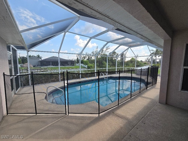 view of pool featuring a lanai and a patio area