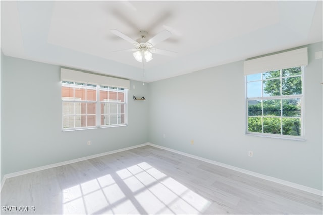 empty room with light wood-type flooring and ceiling fan