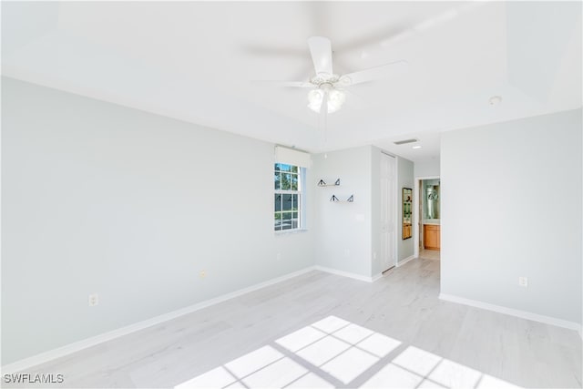 spare room with ceiling fan and light hardwood / wood-style floors