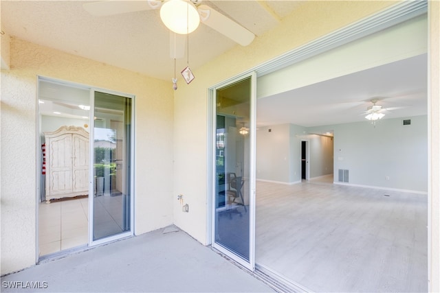 interior space featuring ceiling fan