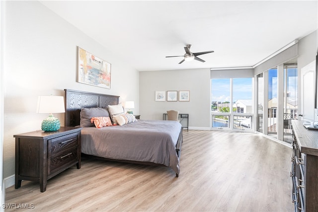 bedroom featuring light wood-type flooring, access to outside, and ceiling fan