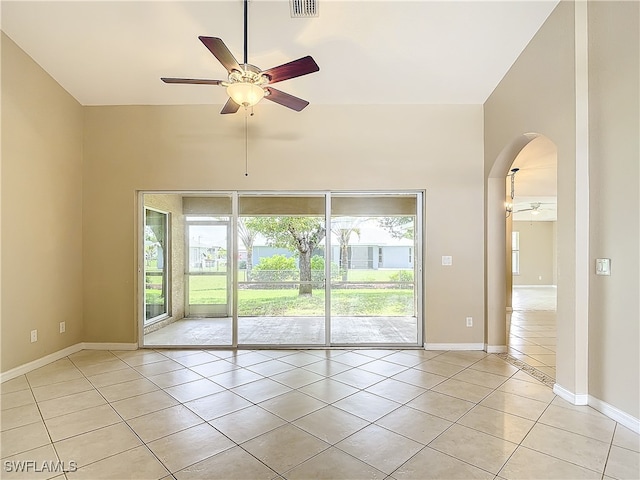 empty room featuring ceiling fan and light tile patterned floors