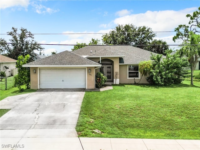 ranch-style home with a garage and a front yard