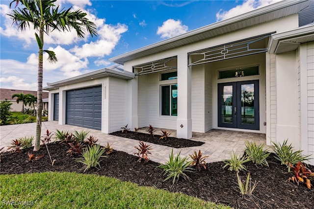 view of front of house featuring a garage and french doors